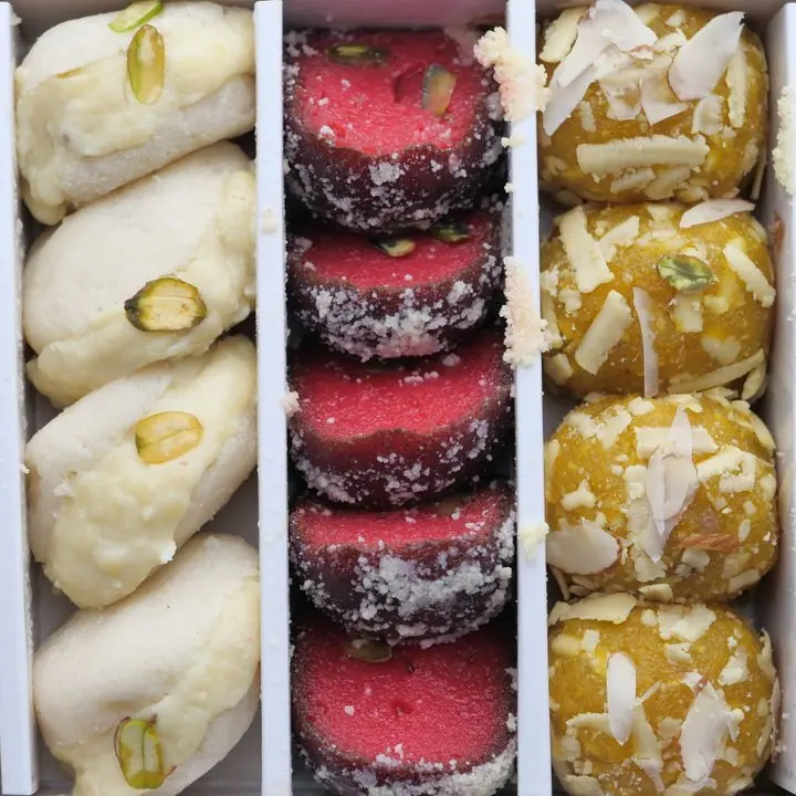 Assorted Sandesh — Plain and kesar sandesh with chhena rolls.