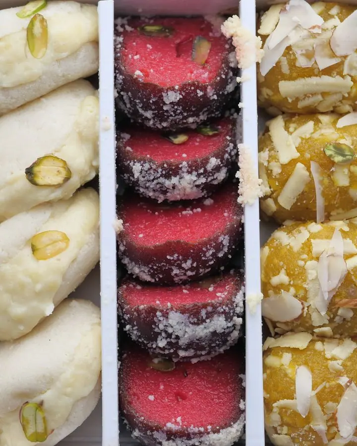 Assorted Sandesh — Plain and kesar sandesh with chhena rolls.