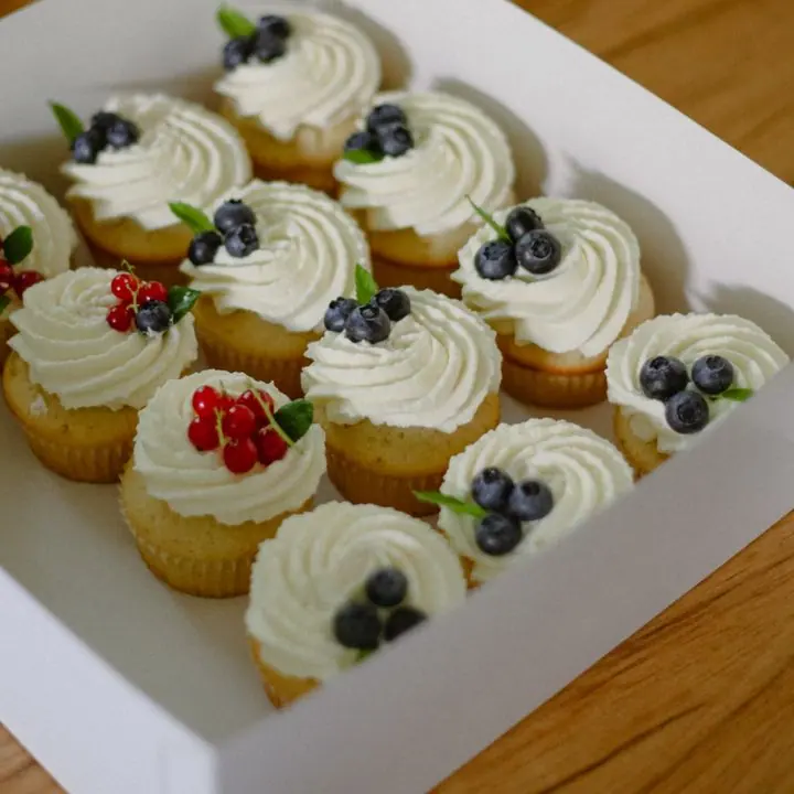 Cream Cupcakes (Box of 6) — Vanilla cupcakes with whipped cream and berries.