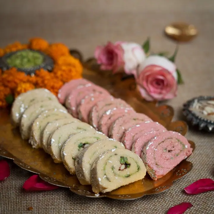 Kaju Pista Roll — Cashew rolls with a pistachio centre.
