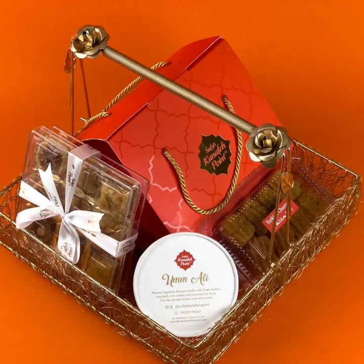 Premium Gift Hamper — Dry fruit sweets, cookies and treats in a hamper basket.