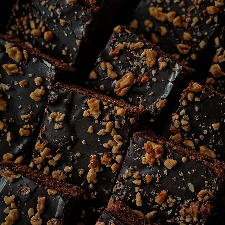 Walnut Brownies — Chocolate brownies topped with crushed walnut.