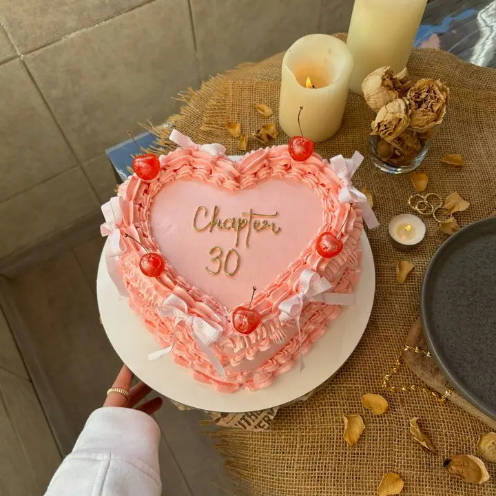 Heart Anniversary Cake — Heart-shaped cream cake with piped borders.