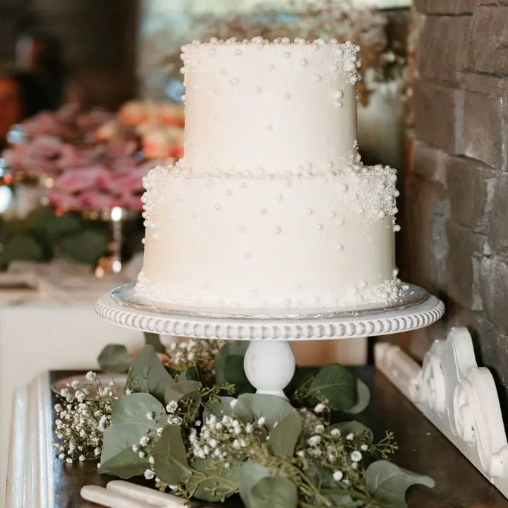 Two-Tier Celebration Cake — White two-tier cake for weddings and anniversaries.