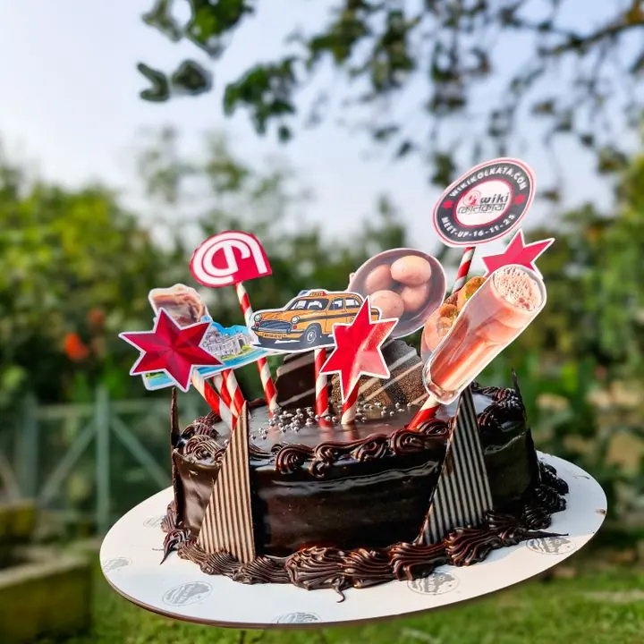 Chocolate Topper Cake — Chocolate cake dressed with themed toppers.