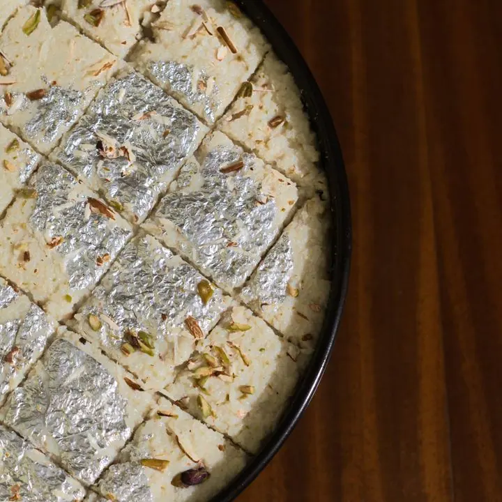 Kalakand — Grainy, moist milk cake cut into diamonds.