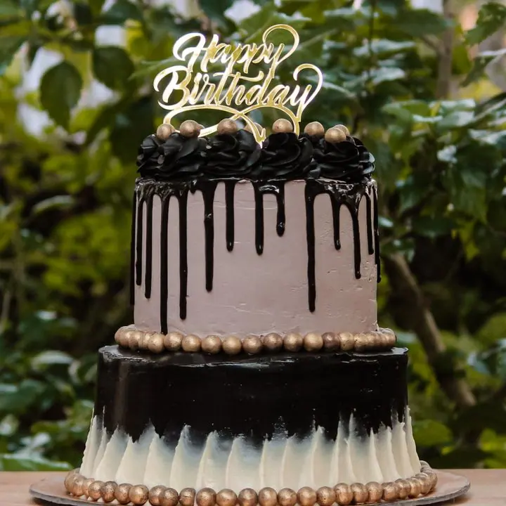 Two-Tier Chocolate Cake — Two tiers of chocolate with a drip finish.