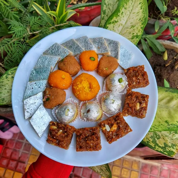 Celebration Mithai Platter — A dressed platter of assorted sweets for occasions.